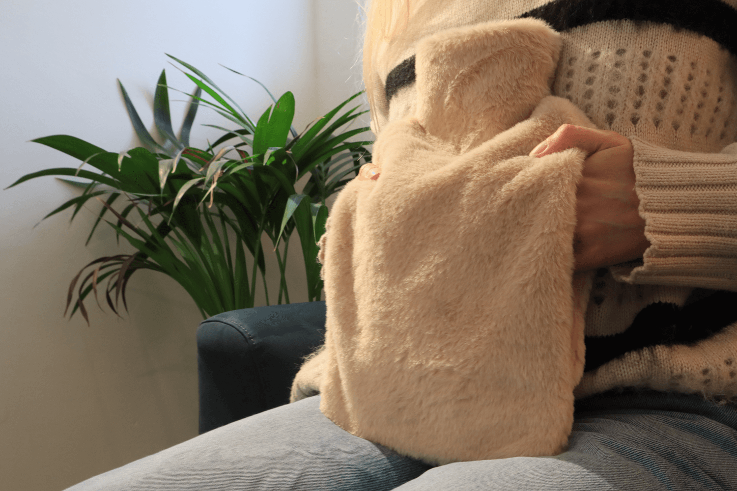 Pouchy-Faux-Fur-Hot-Water-Bottle-in-Biscuit-lifestyle-hands