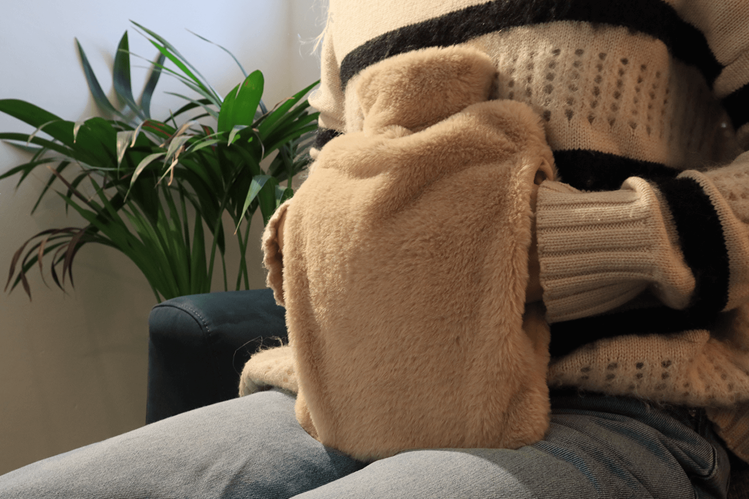 Pouchy-Faux-Fur-Hot-Water-Bottle-in-mocha-lifestyle-hands