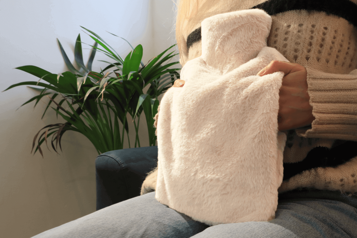 Pouchy-Faux-Fur-Hot-Water-Bottle-in-Biscuit-lifestyle-hands-newest